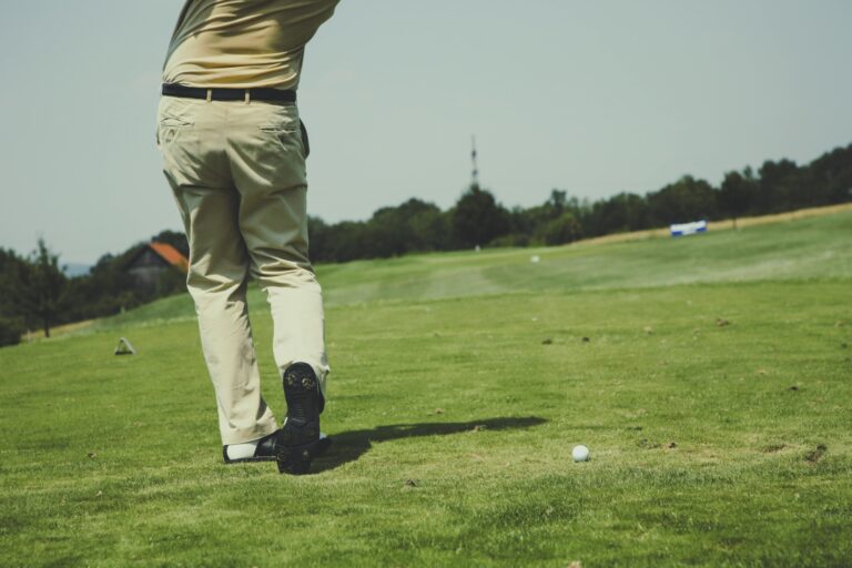 A man on a golf course in the concept of services and amenities in Chiswick.