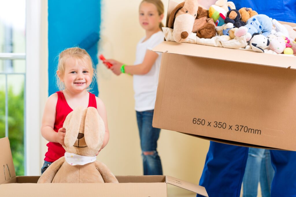 A family packing lots of children's toys